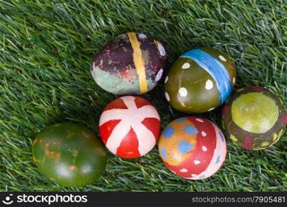Happy easter eggs group on grass,can use as background for god festival, top view
