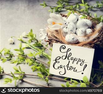 Happy Easter greeting card with bird nest and eggs