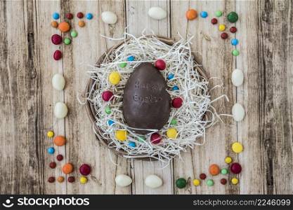 happy easter inscription chocolate egg