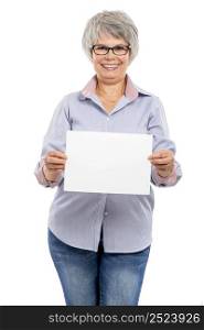 Happy elderly woman holding a blank paper card with copy space for the designer