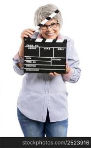 Happy elderly woman holding a clapboard, isolated on white background