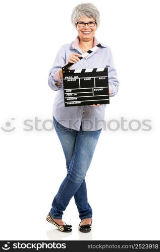 Happy elderly woman holding a clapboard, isolated on white background