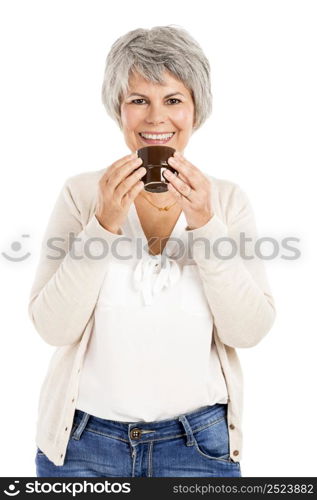 Happy elderly woman holding and drinking a cup of coffee