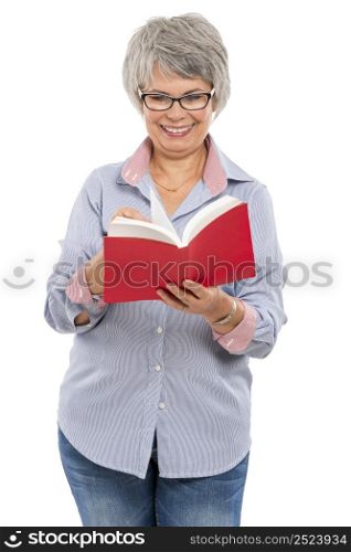 Happy elderly woman holding and reading a book