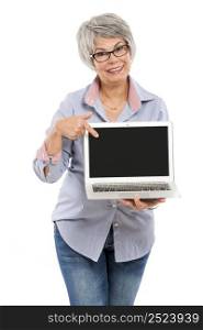 Happy elderly woman holding and showing something on a laptop