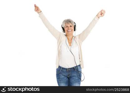 Happy elderly woman listen music with headphones, isolated over white background
