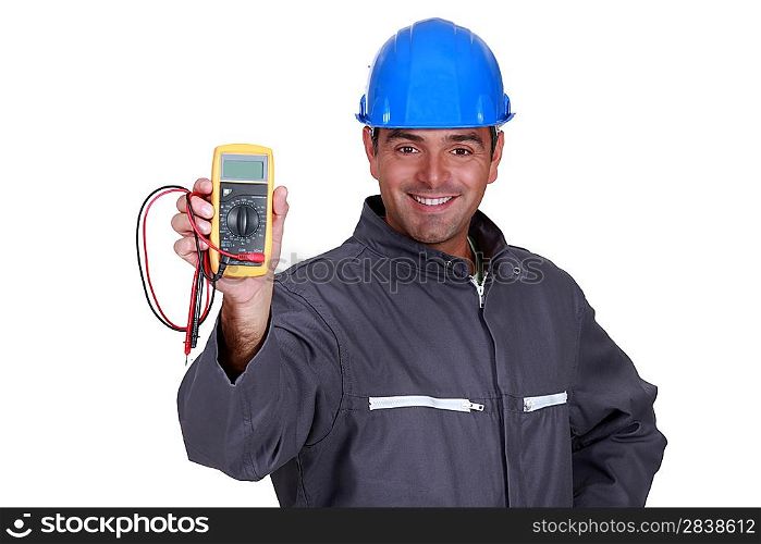 happy electrician showing multimeter