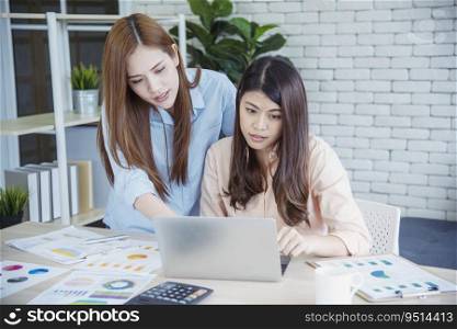 Happy entrepreneur asian businesswomen using smartphone dealing negotiate for startup business. Two partners enjoy good news from smartphone teamwork collaboration asian woman working together