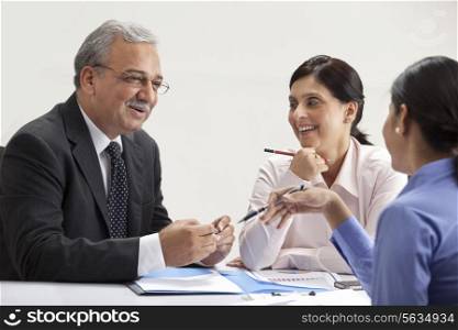 Happy executives discussing in a meeting
