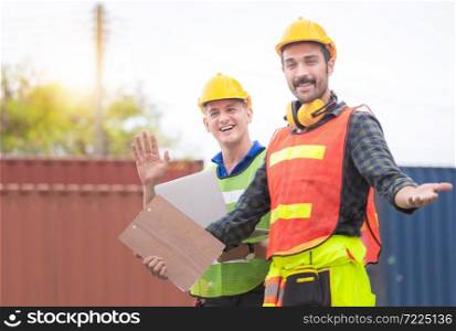Happy factory worker man team in hard hat smiling and looking at camera with joy, Happiness and funny concept