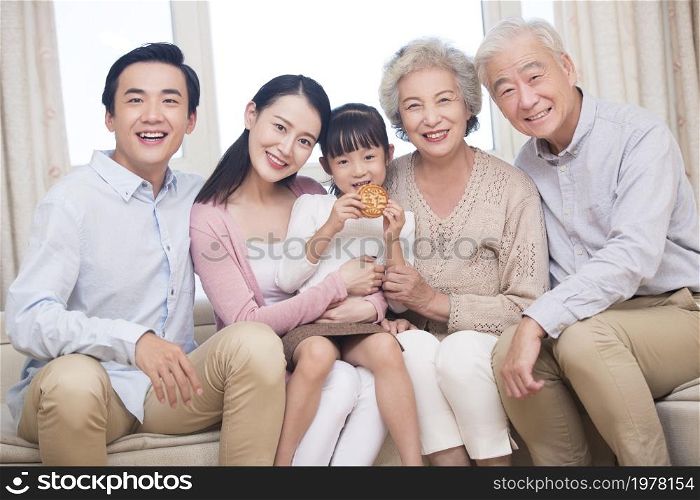 Happy families using a tablet computer together