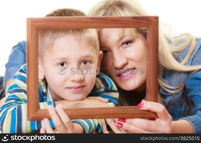 Happy family and love concept. Portrait of middle-aged mother with son little boy holding frame decorations studio shot isolated on white