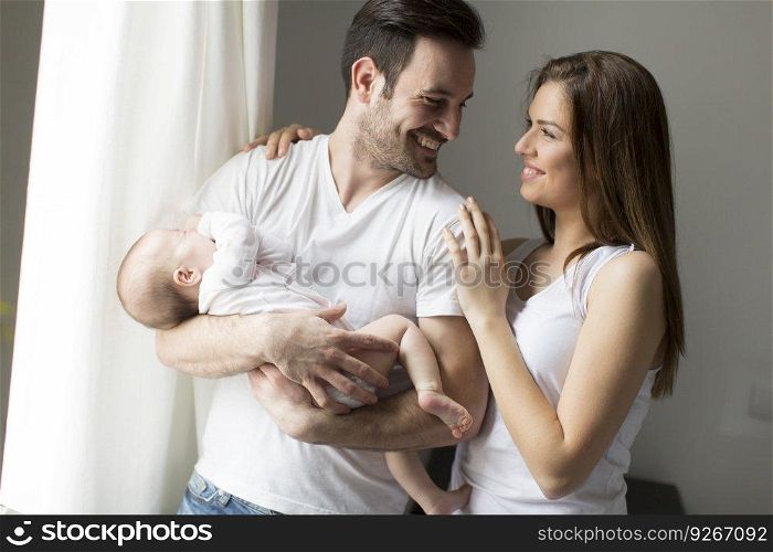 Happy family by the window