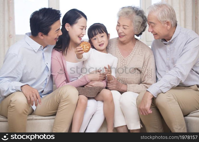 Happy family celebrating Mid-Autumn Festival