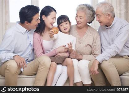 Happy family celebrating Mid-Autumn Festival