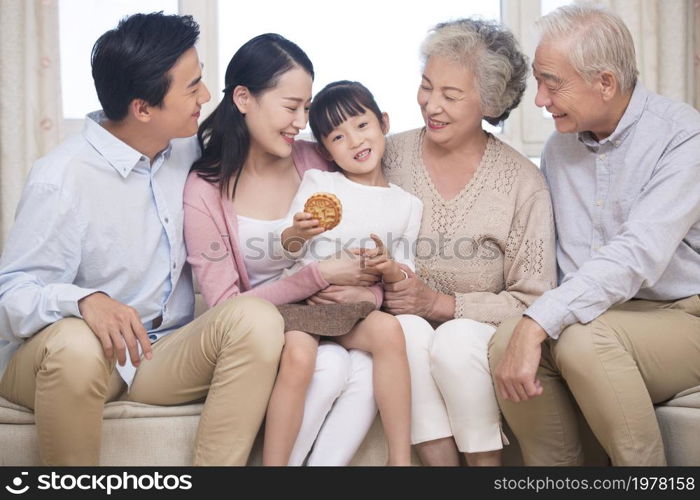 Happy family celebrating Mid-Autumn Festival