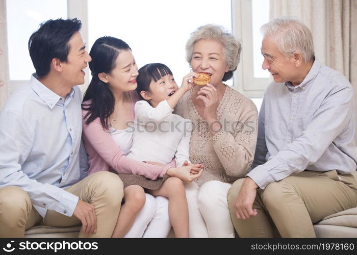 Happy family celebrating Mid-Autumn Festival