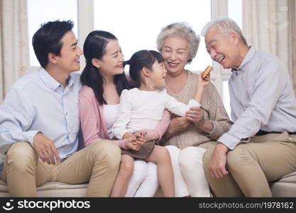 Happy family celebrating Mid-Autumn Festival