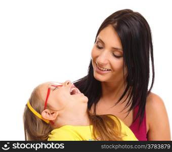 Happy family, cute little girl child playing with mom together doing fun. Daughter and mother embracing isolated on white
