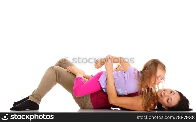 Happy family, cute little girl child playing with mom together doing fun. Daughter and her mother isolated on white