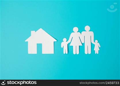 Happy Family day. paper shape cutout with Father, Mother, Children and Home. international day of families, Warm home, love, Foster, Insurance, Charity and Donation concepts.