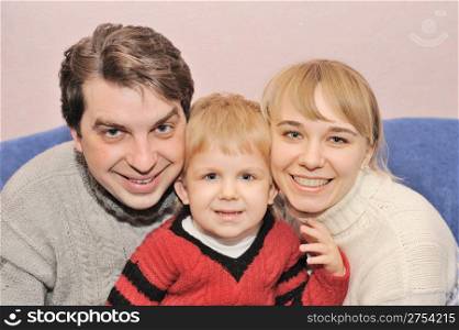Happy family. Family from three person in house conditions
