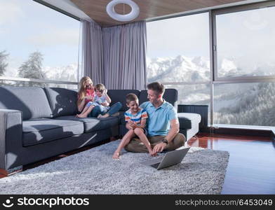 Happy family. Father, mother and children playing a video game Father and son playing video games together on the floor