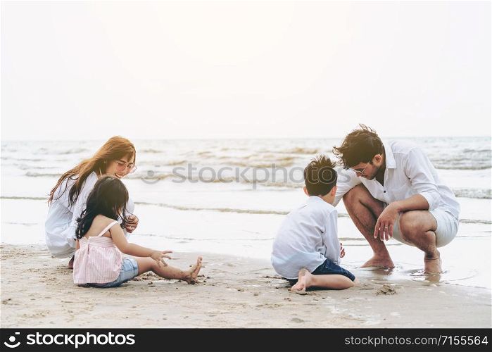 Happy family goes vacation on the beach in summer.