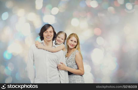 Happy family. Happy family of mother father and daughter against bokeh background