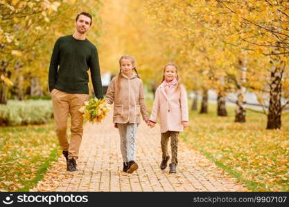 Happy family have fun on beautiful autumn day in the park. Dad and kids together outdoors. Family of dad and kids on beautiful autumn day in the park