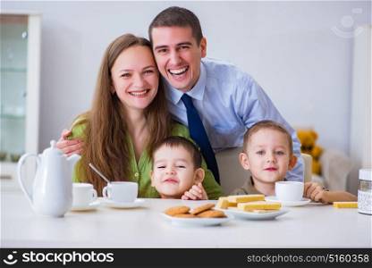 Happy family having breakfast together at home