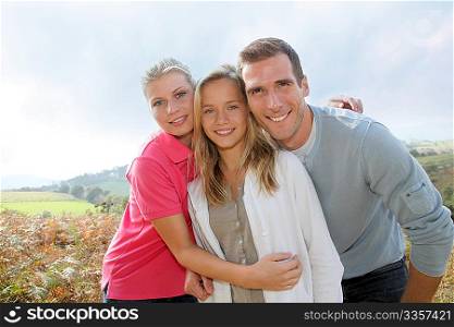 Happy family having fun in the countryside