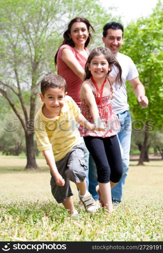 Happy family having fun in the park,outdoor