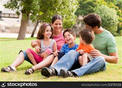 Happy family having fun in the park,outdoors