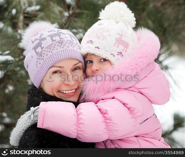 Happy family having fun in winter park