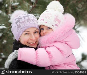 Happy family having fun in winter park