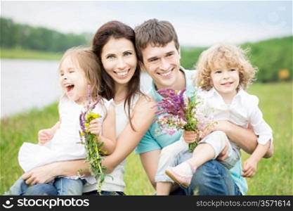 Happy family having fun outdoors in spring
