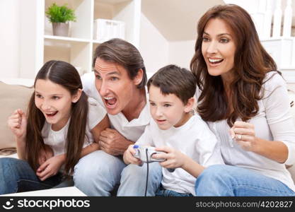 Happy Family Having Fun Playing Video Console Games