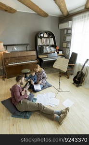 Happy family having fun time at home playing on the floor in the room