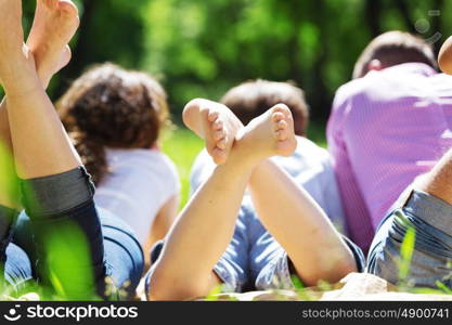 Happy family having weekend in summer park. Picnic in garden