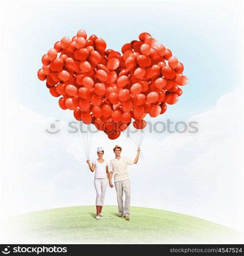 Happy family. Image of young happy family with bunch of balloons