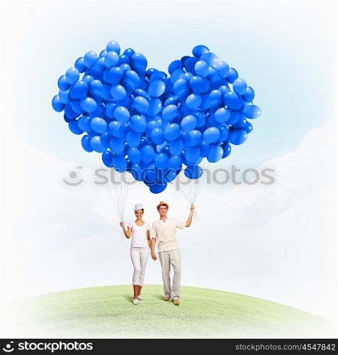Happy family. Image of young happy family with bunch of balloons