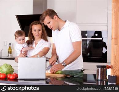 Happy Family in Kitchen Preparing Meal