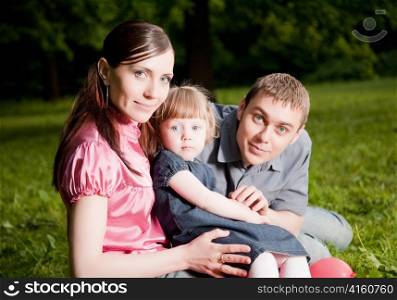 Happy Family in The Park. Close-Up Portrait
