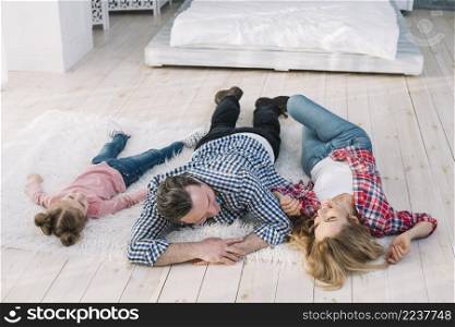happy family lying fur carpet home