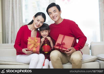 Happy family of three celebrating the New Year