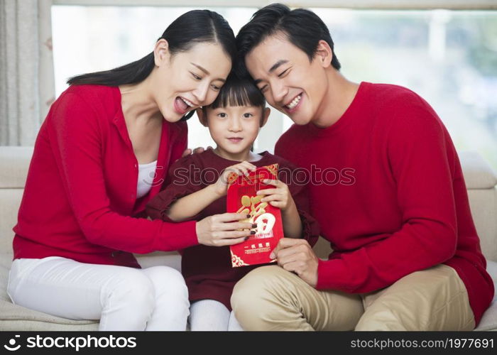 Happy family of three celebrating the New Year