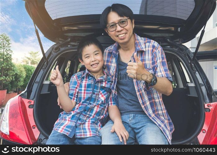 Happy family on a road trip, Sitting In Trunk Of Car