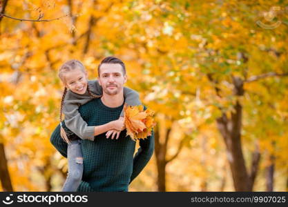 Happy family on beautiful autumn day outdoors.. Family of dad and kid on beautiful autumn day in the park