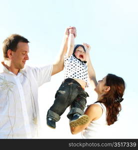 happy family on blue sky background